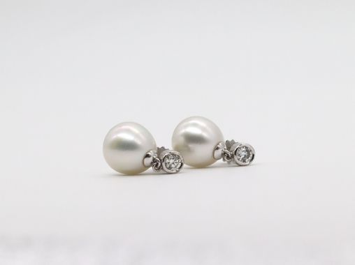 SOLD - A pair of pre-owned Souths Seas cultured pearl and diamond earrings